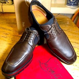 Dark brown Christian Louboutin worn only twice.